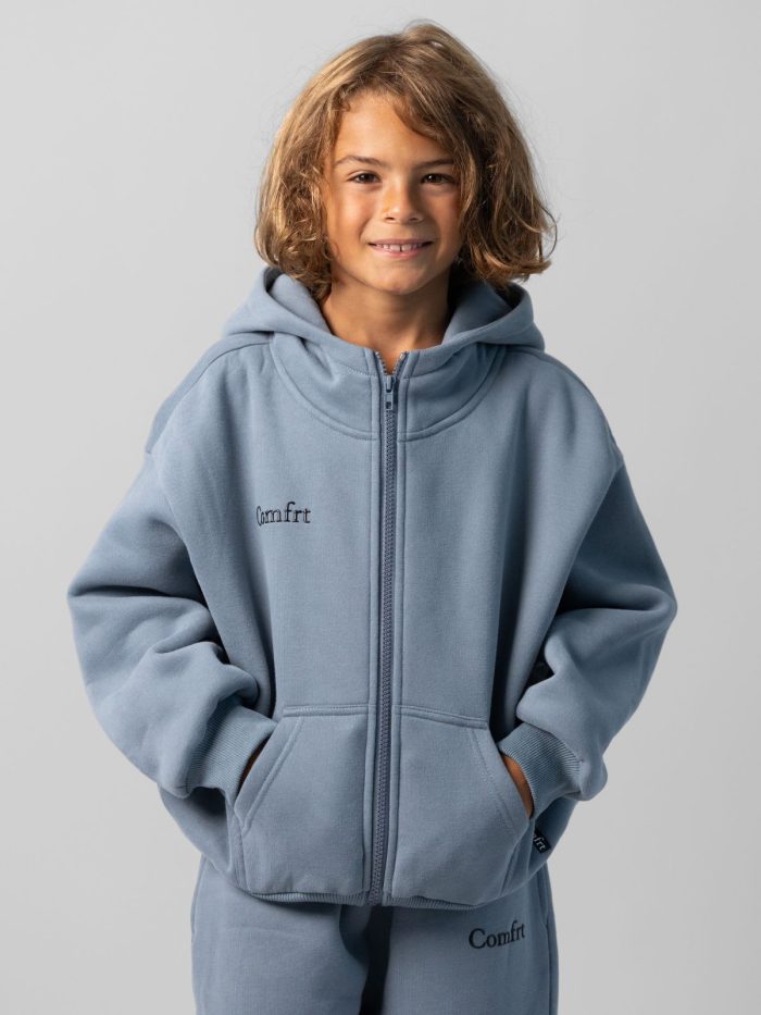 Cloud Zip Kids Hoodie: Jaydn is 7 wearing a size S